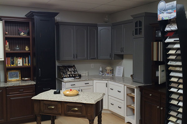 Kitchen display with white lower cabinets and dark gray upper cabinets