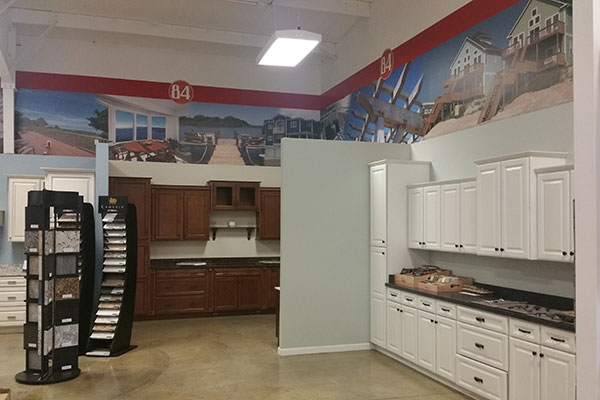 Kitchen displays featuring white and dark brown cabinets